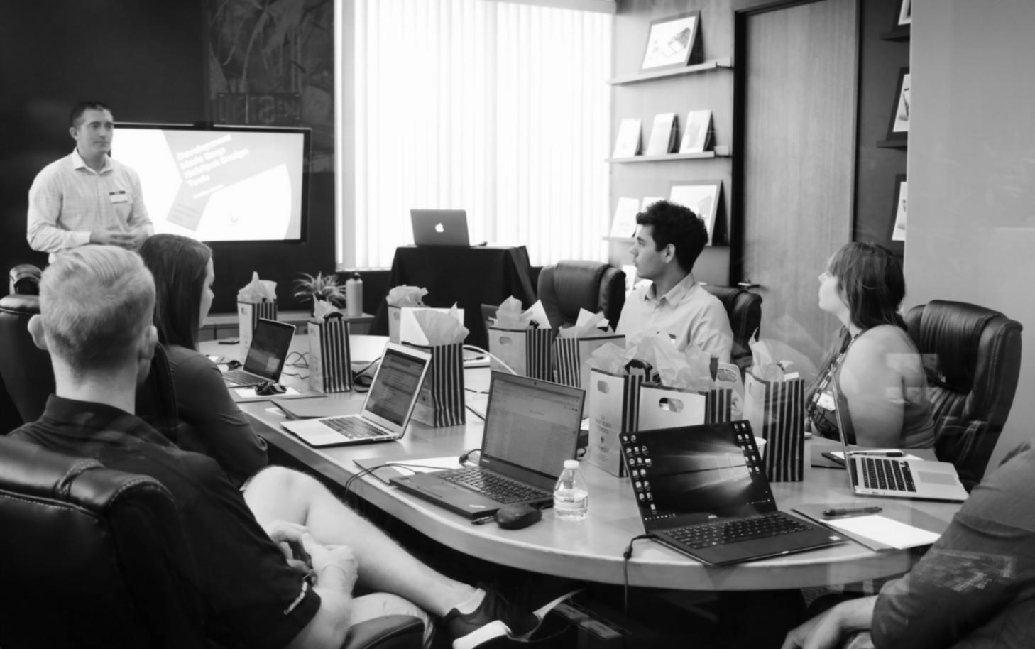 Machine learning workspace with multiple monitors showing data visualizations